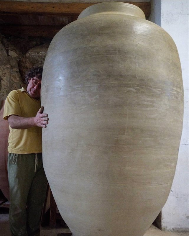 Ceramist Carles Llarch and one of his amphorae